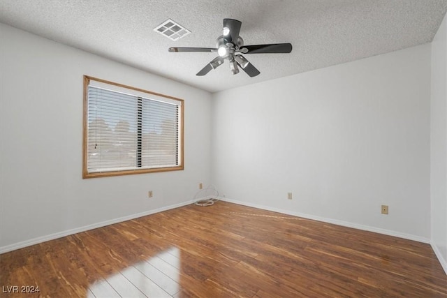 spare room featuring ceiling fan, a textured ceiling, and hardwood / wood-style floors