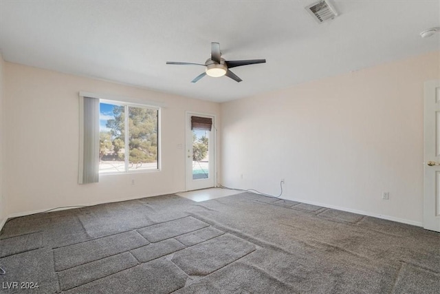 spare room with carpet floors and ceiling fan