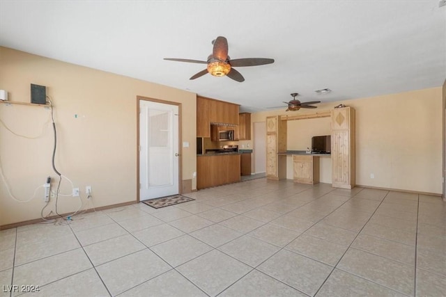 unfurnished living room featuring ceiling fan and light tile patterned flooring