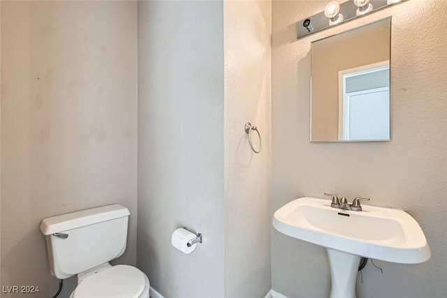 bathroom with toilet and sink