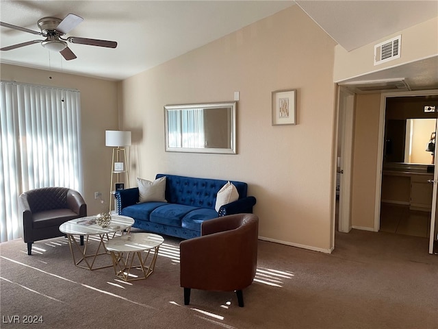 living room featuring carpet, ceiling fan, vaulted ceiling, and a healthy amount of sunlight