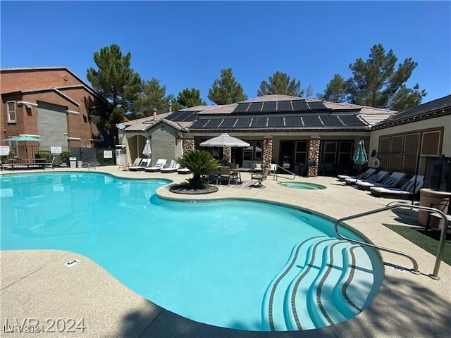 view of swimming pool featuring a patio area