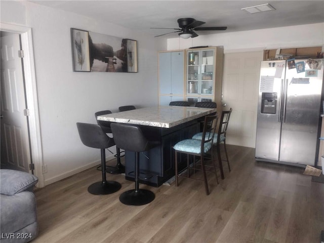 dining room featuring dark wood-type flooring and ceiling fan