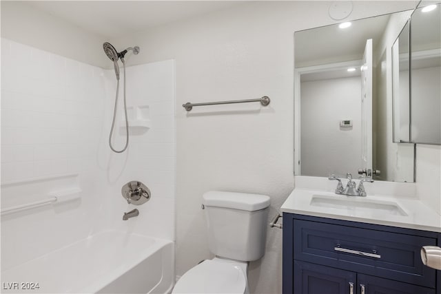 full bathroom featuring bathing tub / shower combination, vanity, and toilet