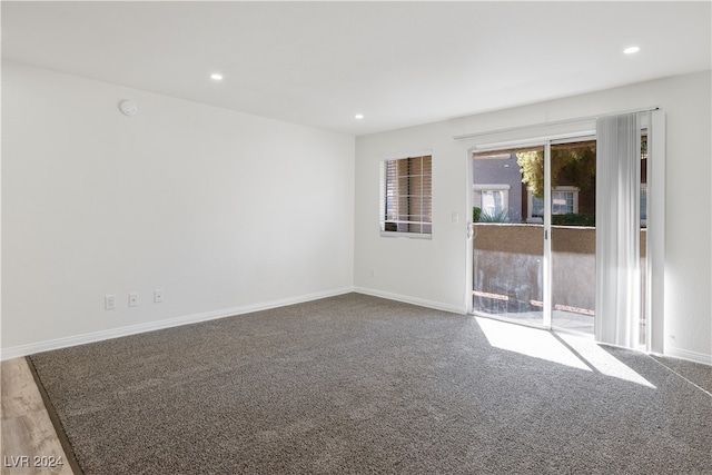 empty room with hardwood / wood-style flooring