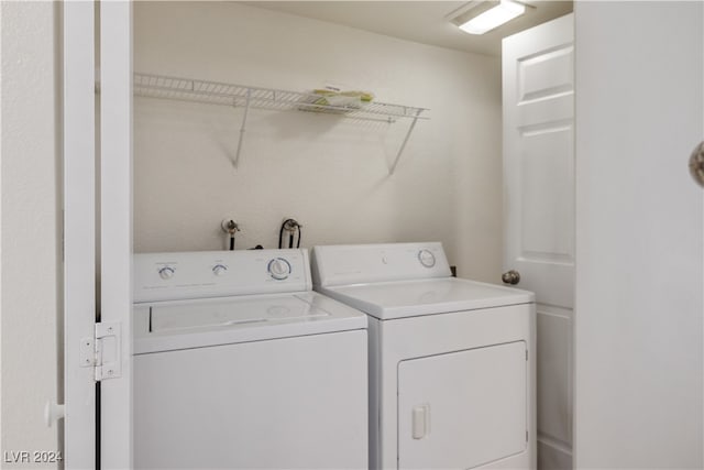 washroom with washing machine and dryer