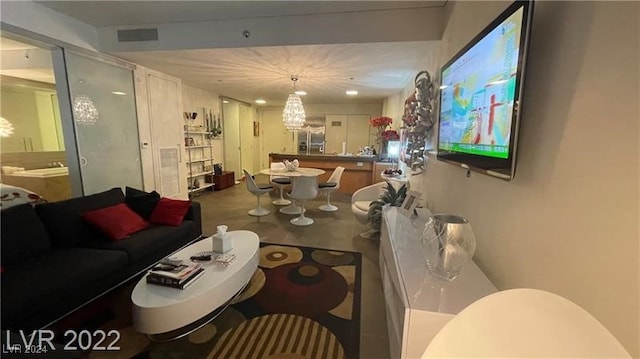 living room featuring an inviting chandelier