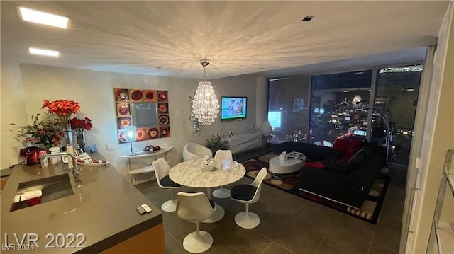 tiled dining room featuring a chandelier