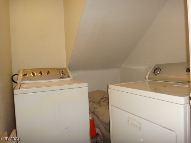 laundry area with washing machine and clothes dryer