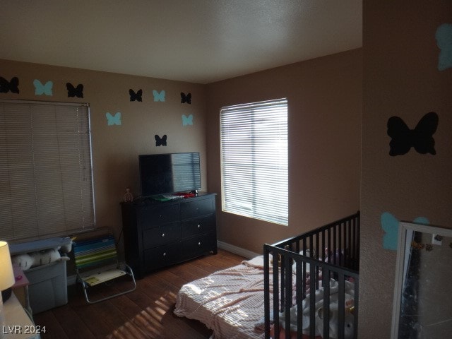 bedroom featuring wood-type flooring