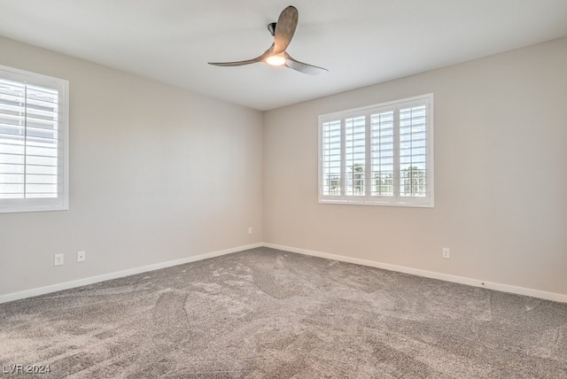 unfurnished room featuring carpet floors and ceiling fan