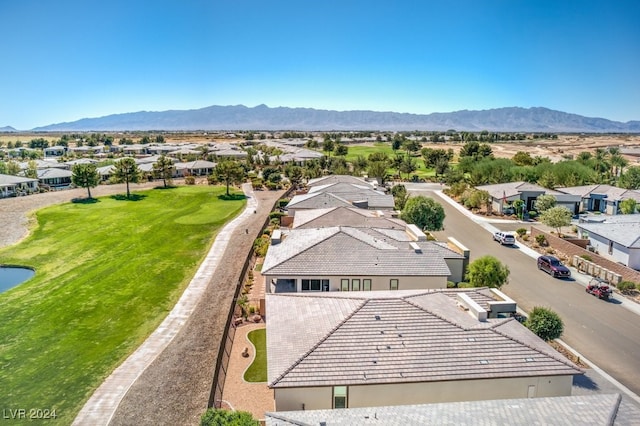 birds eye view of property with a mountain view