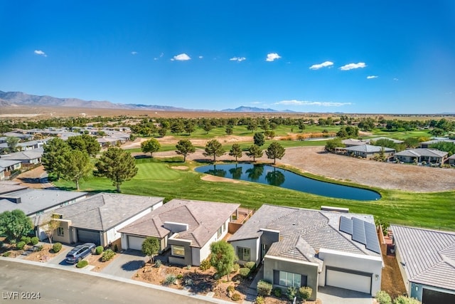 birds eye view of property featuring a water and mountain view