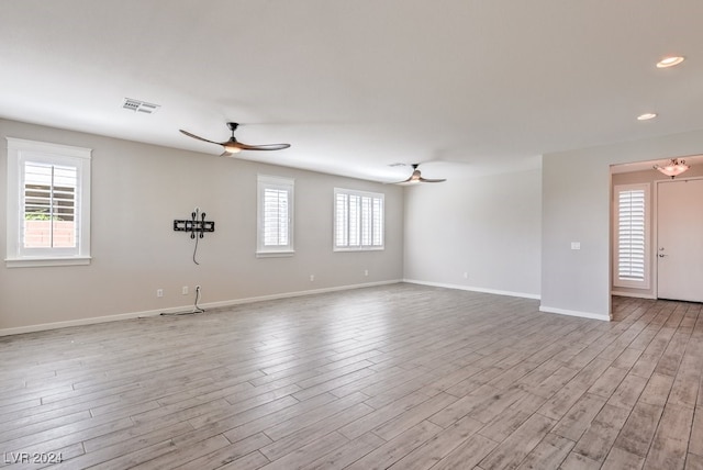 unfurnished room with light hardwood / wood-style floors and ceiling fan