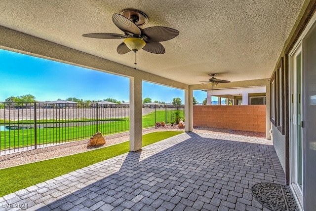 view of patio featuring ceiling fan