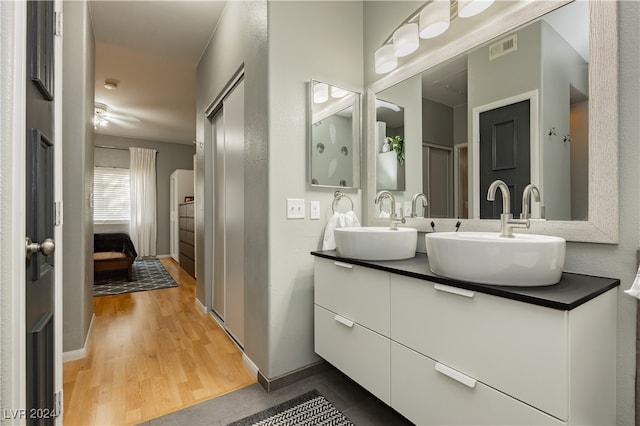 bathroom featuring vanity and hardwood / wood-style flooring