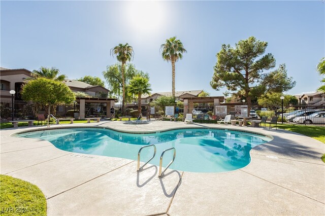 view of swimming pool with a patio