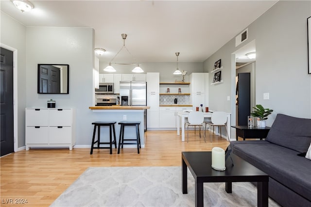 living room with light hardwood / wood-style floors