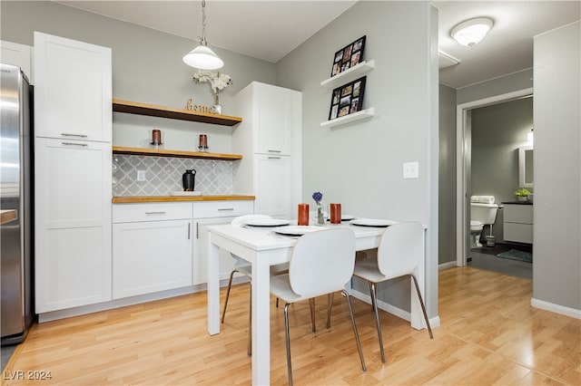 dining space with light wood-type flooring