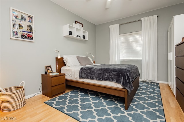 bedroom featuring ceiling fan and hardwood / wood-style floors