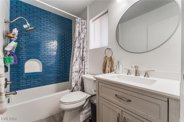 full bathroom with vanity, toilet, and shower / bath combo