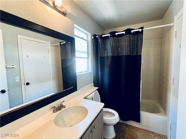 full bathroom with shower / tub combo with curtain, vanity, and toilet