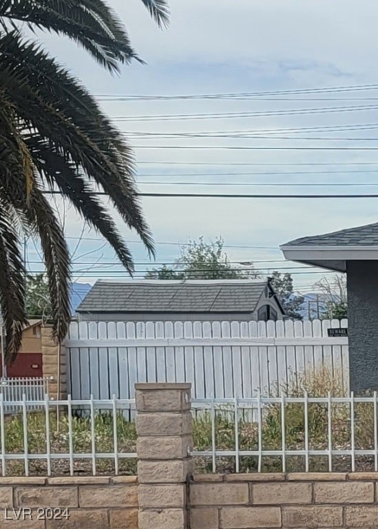 5156 Treasure Ave, Las Vegas, NV 89122 - view of side of home with roof with shingles