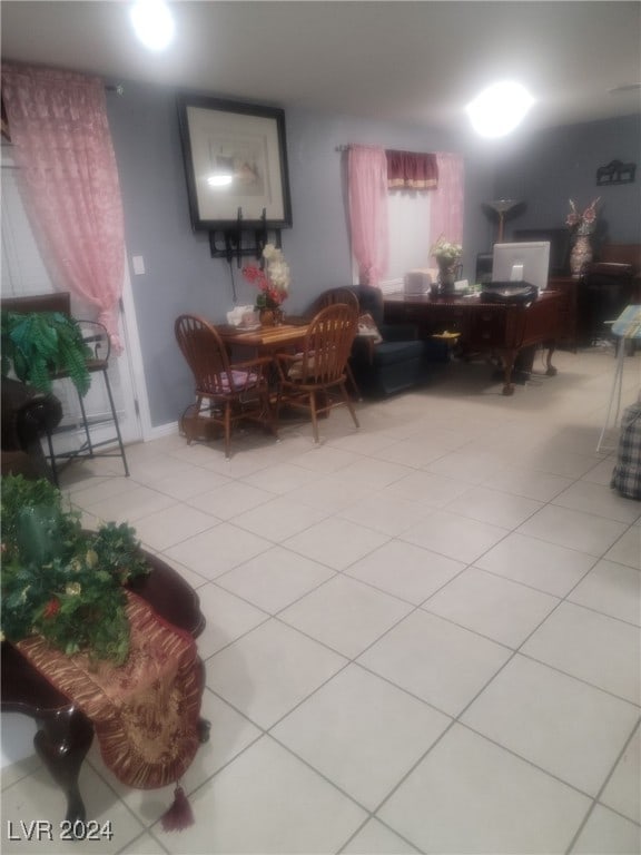 dining area with light tile patterned floors