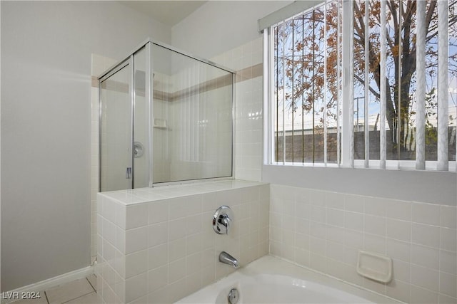 bathroom with plus walk in shower and tile patterned floors