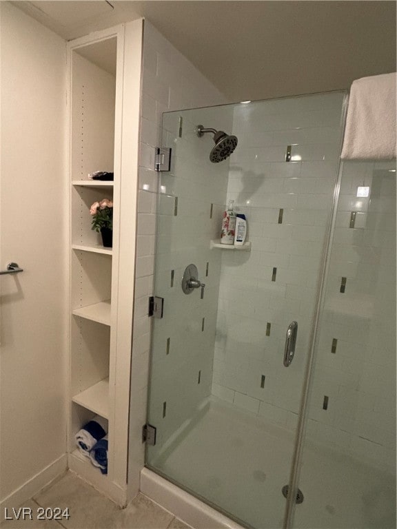 bathroom featuring tile patterned flooring and walk in shower