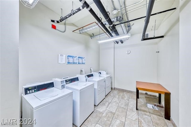 clothes washing area featuring washing machine and clothes dryer