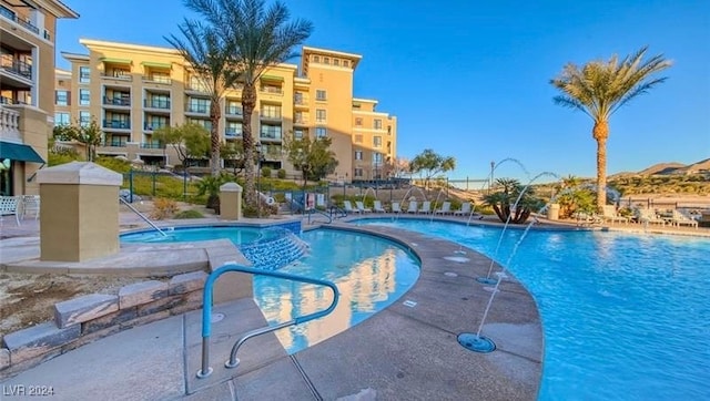 view of pool featuring pool water feature