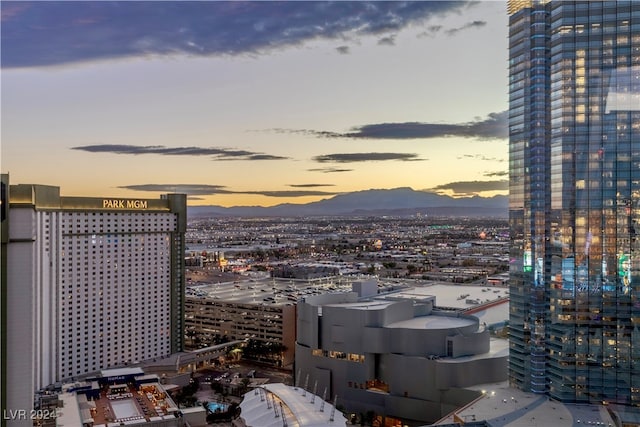 property's view of city with a mountain view