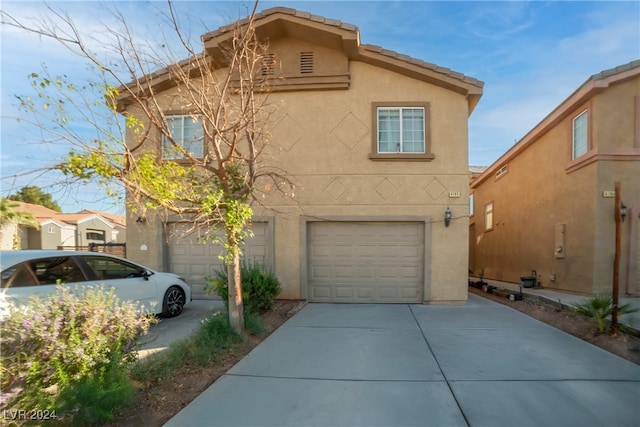 view of front of home with a garage