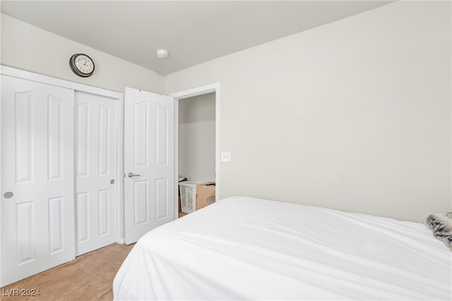 carpeted bedroom featuring a closet