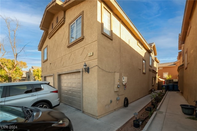 view of property exterior with a garage