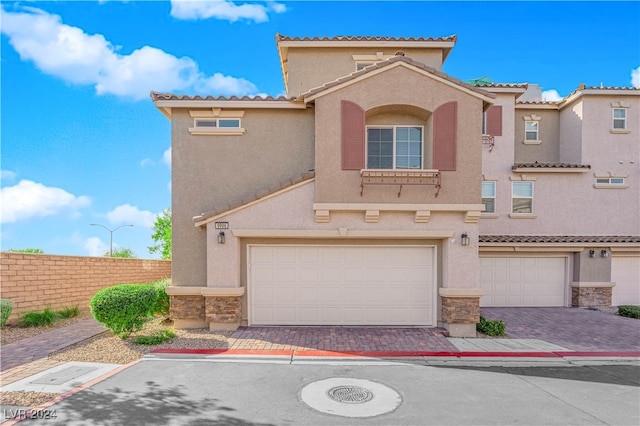 mediterranean / spanish-style house featuring a garage