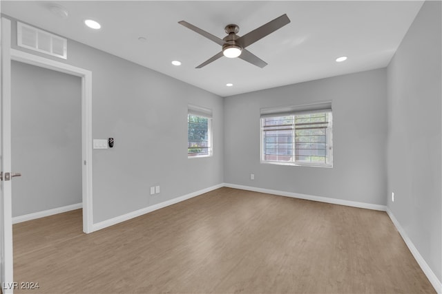 unfurnished room with ceiling fan and light hardwood / wood-style flooring