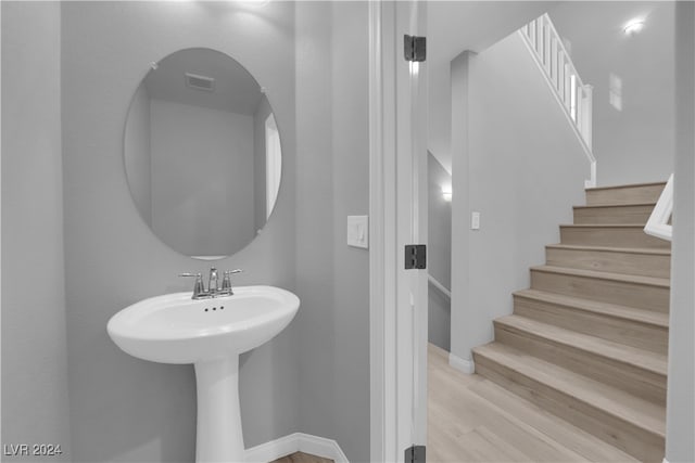 bathroom featuring hardwood / wood-style floors and sink