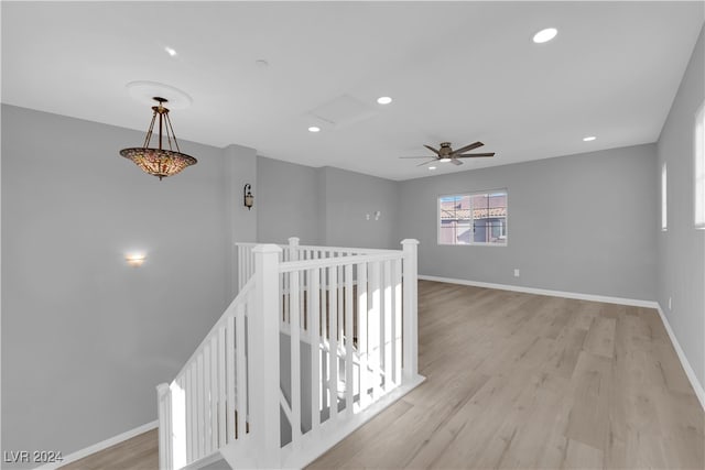 hall with light hardwood / wood-style floors