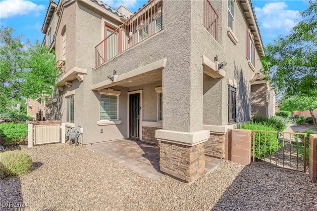 exterior space with a patio and a balcony