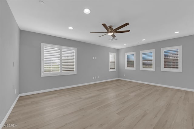 empty room featuring ceiling fan and light wood-type flooring