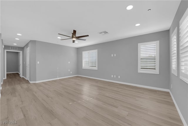 unfurnished room featuring light wood-type flooring and ceiling fan