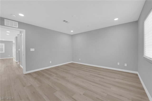 spare room with light wood-type flooring