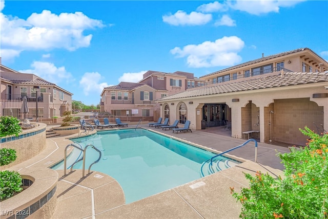 view of swimming pool featuring a patio area