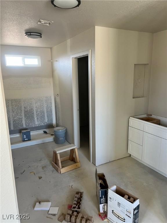 bathroom with a textured ceiling