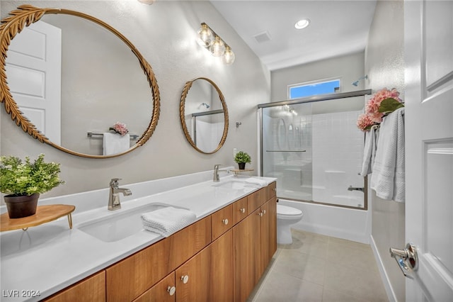 full bathroom featuring toilet, tile patterned floors, vanity, and shower / bath combination with glass door