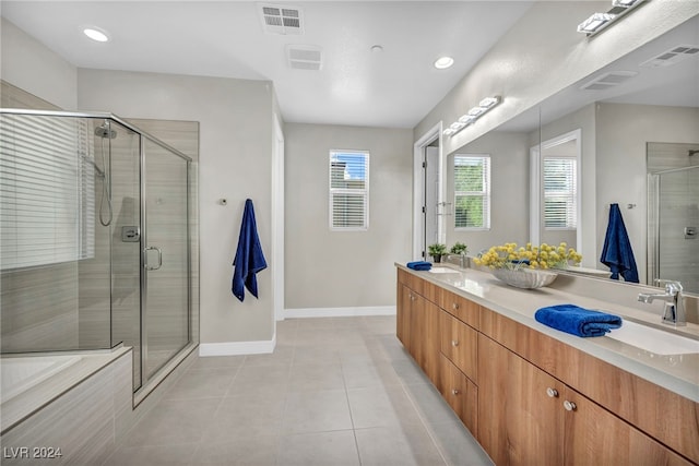 bathroom with independent shower and bath, tile patterned flooring, and vanity