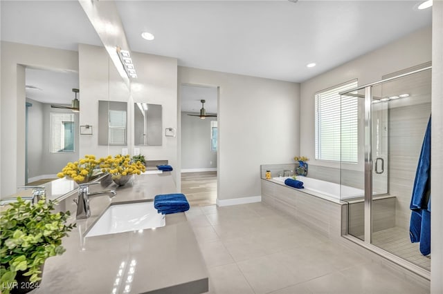 bathroom with tile patterned flooring, vanity, and independent shower and bath