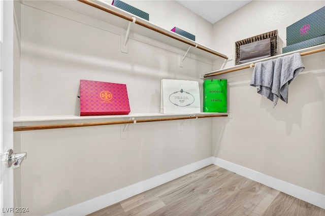 walk in closet featuring light hardwood / wood-style floors